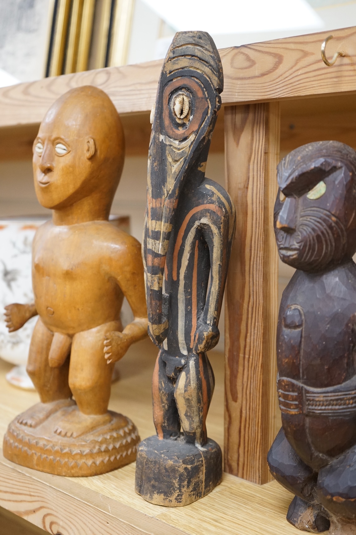 Three wood tribal figures, Africa, South Seas, tallest 37.5cm